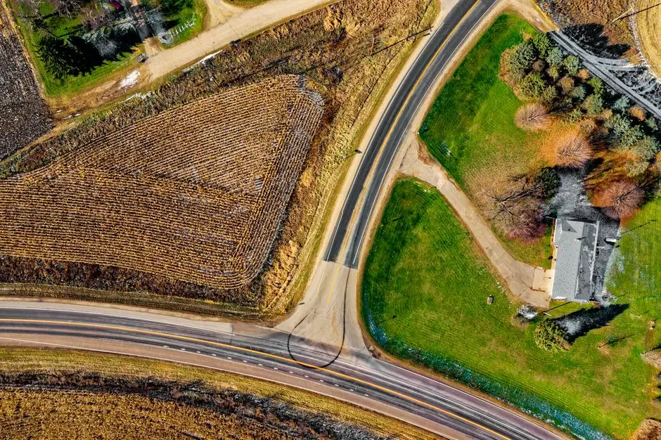 Aerial view of farmland along a rural highway intersection